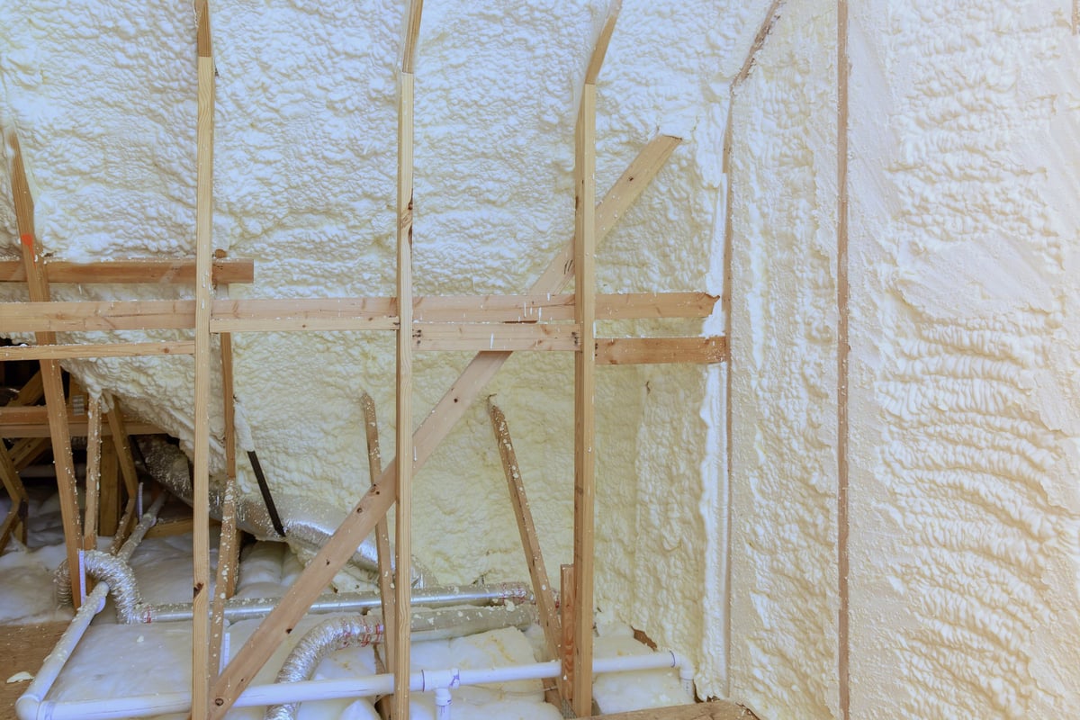 Spray foam insulation applied under the roof of a new residence