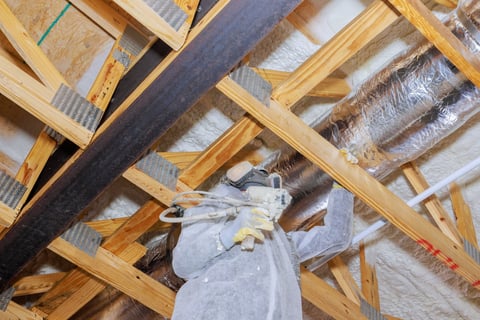 Spray foam insulation applied to an attic ceiling